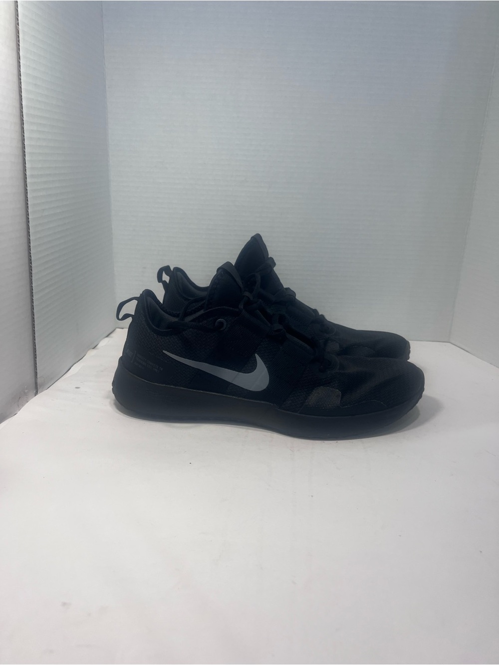 Nike Men's Black Athletic Shoes with Silver Swoosh